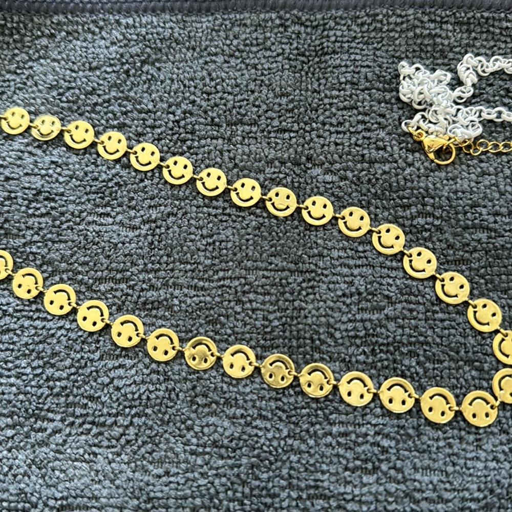 2 smiley face necklaces